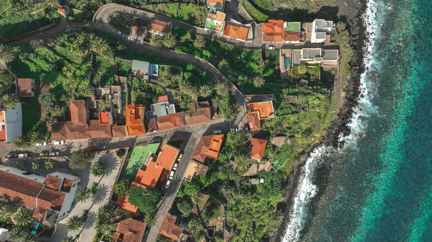 Aerial view of a coastal village on a rocky shoreline